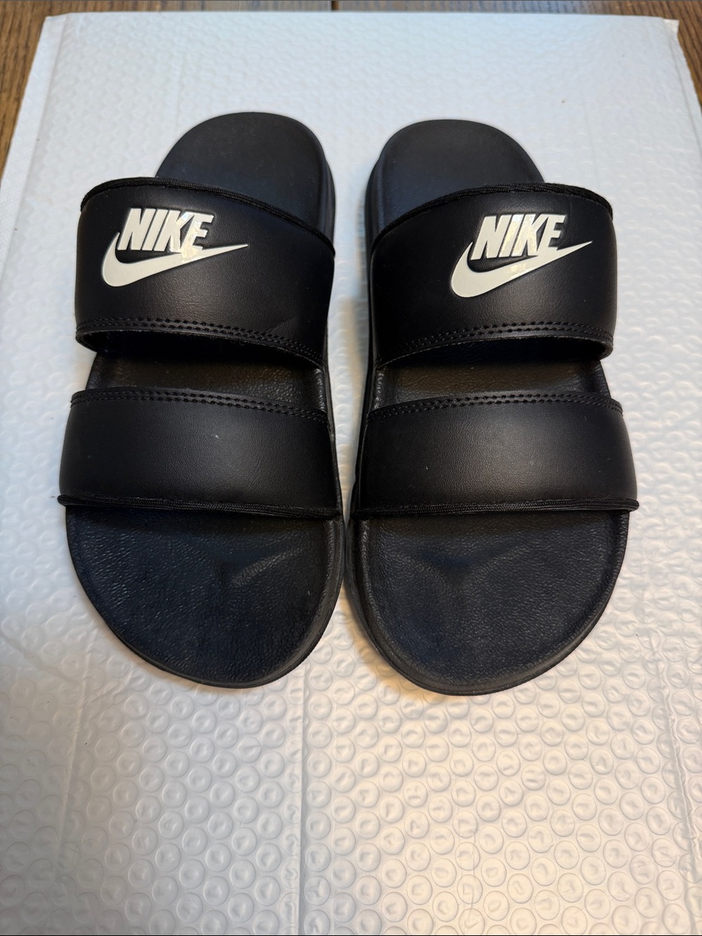 Nike Black Slides with White Swoosh Double Straps